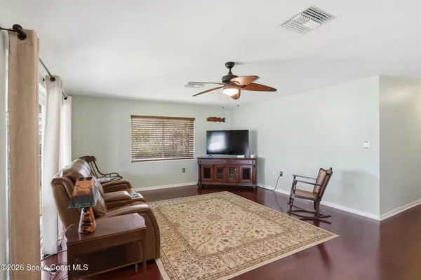 a view of a livingroom with furniture and windows