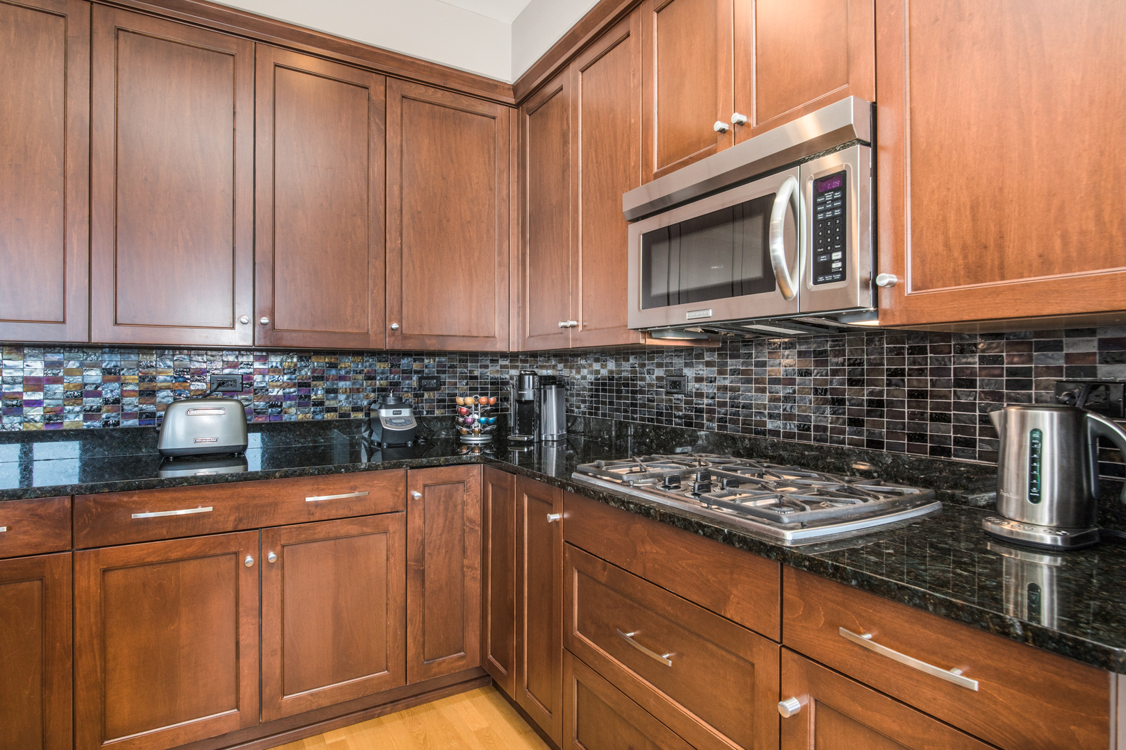 120 North Northwest Highway, Unit 506 Park Ridge, IL 60068 - Photo 6 of 20 a kitchen with granite countertop cabinets and steel stainless steel appliances