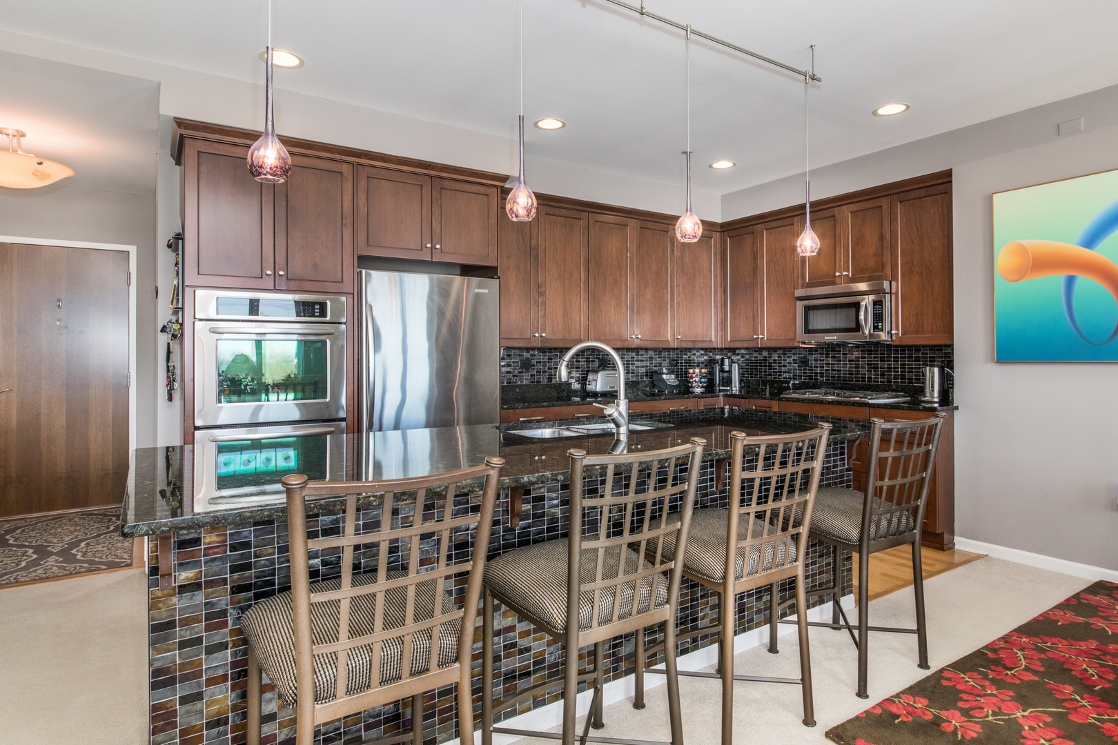 120 North Northwest Highway, Unit 506 Park Ridge, IL 60068 - Photo 8 of 20 a kitchen with granite countertop a refrigerator stove top oven and cabinets