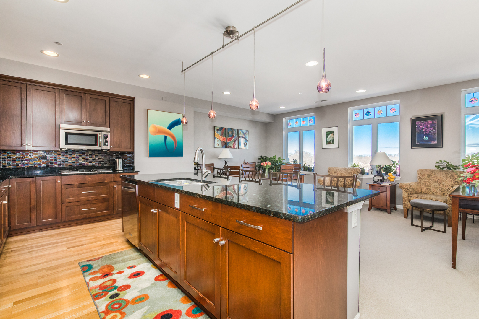 120 North Northwest Highway, Unit 506 Park Ridge, IL 60068 - Photo 9 of 20 a kitchen with kitchen island granite countertop a sink and counter space