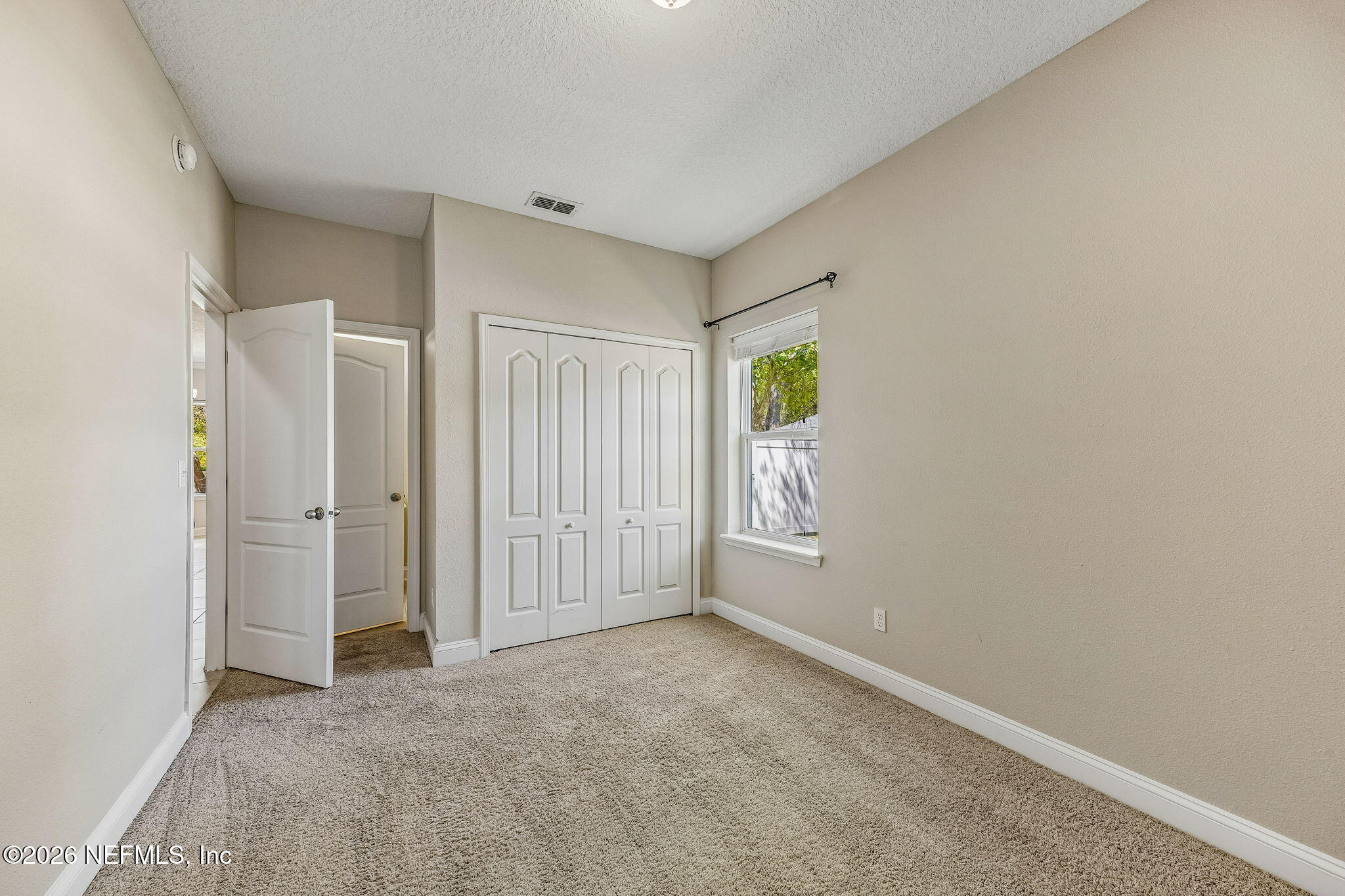 12198 Ridge Crossing Way Jacksonville, FL 32226 - Photo 33 of 67 a view of an empty room with a window