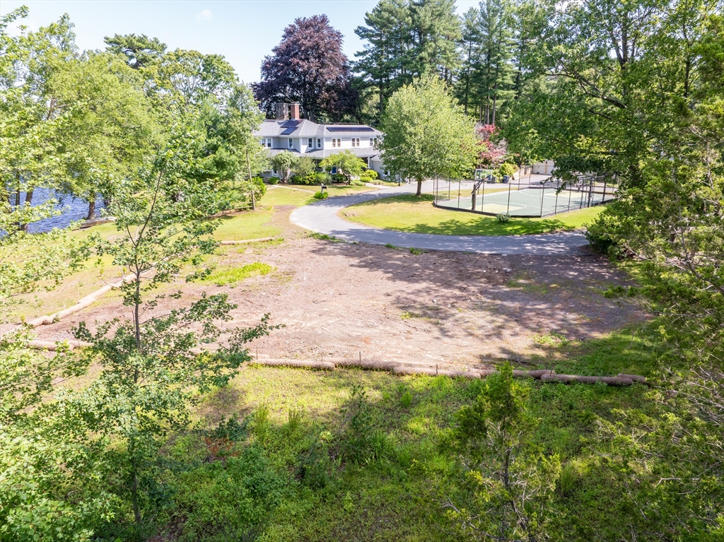 14 Geneva Road Andover, MA 01810 - Photo 23 of 36 a view of a swimming pool with a yard