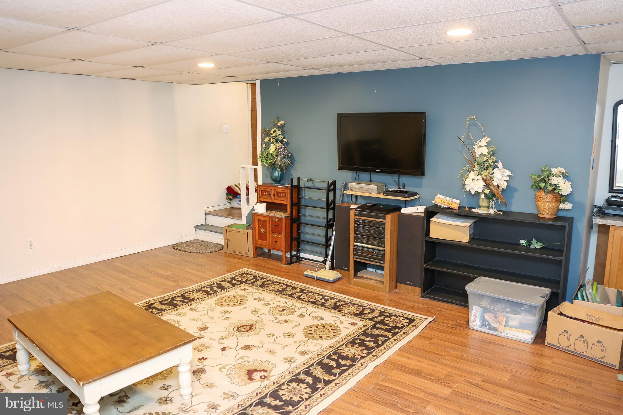 57 Fairview Road Belleville, PA 17004 - Photo 14 of 36 a living room with a flat screen tv and a rug
