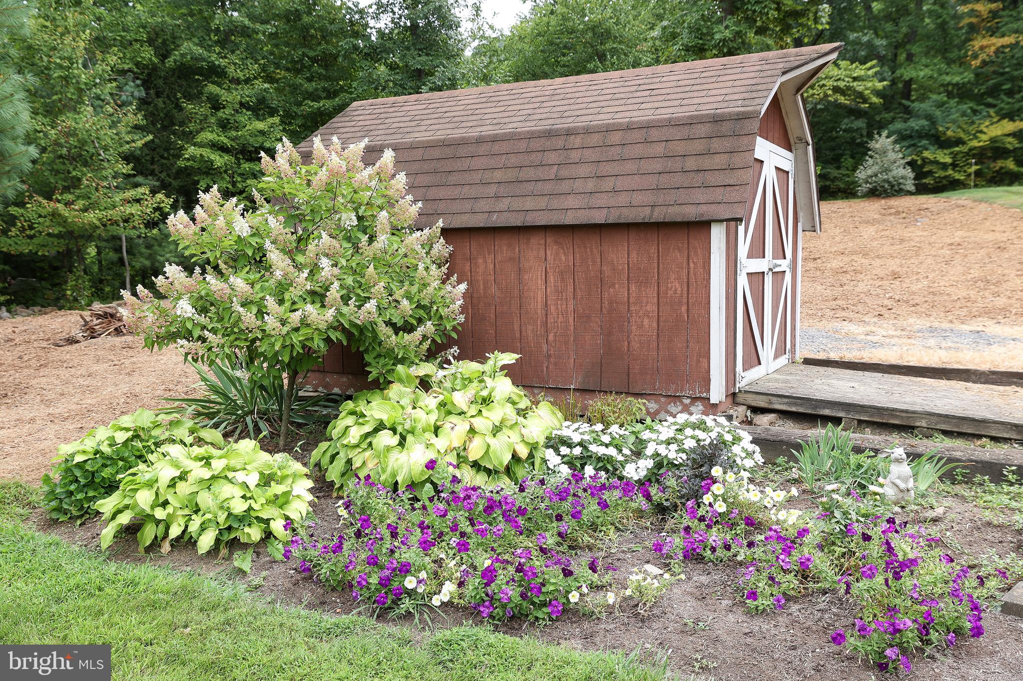 57 Fairview Road Belleville, PA 17004 - Photo 16 of 36 a front view of house with flowers