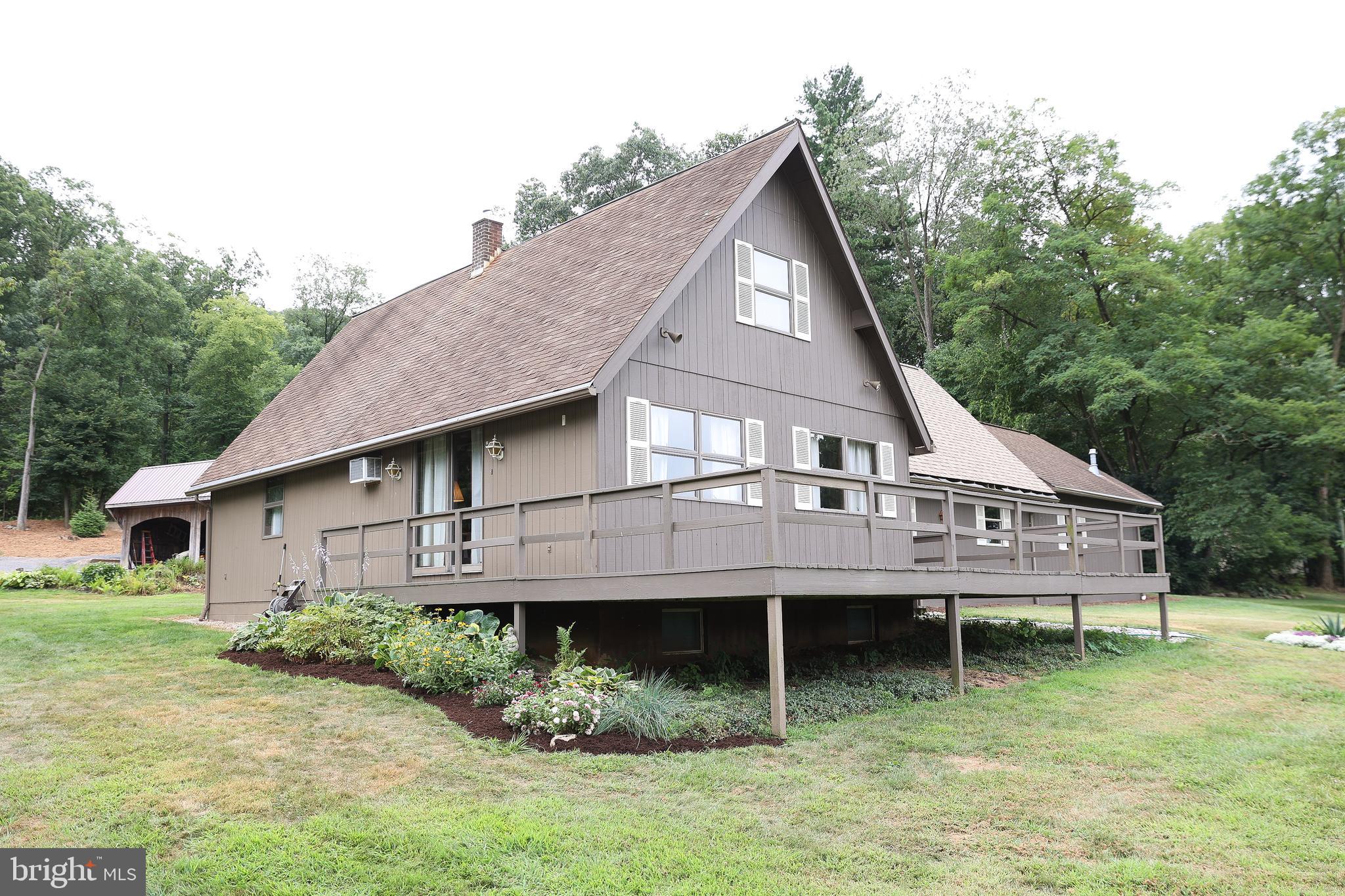 57 Fairview Road Belleville, PA 17004 - Photo 18 of 36 a aerial view of a house next to a yard with plants and large tree