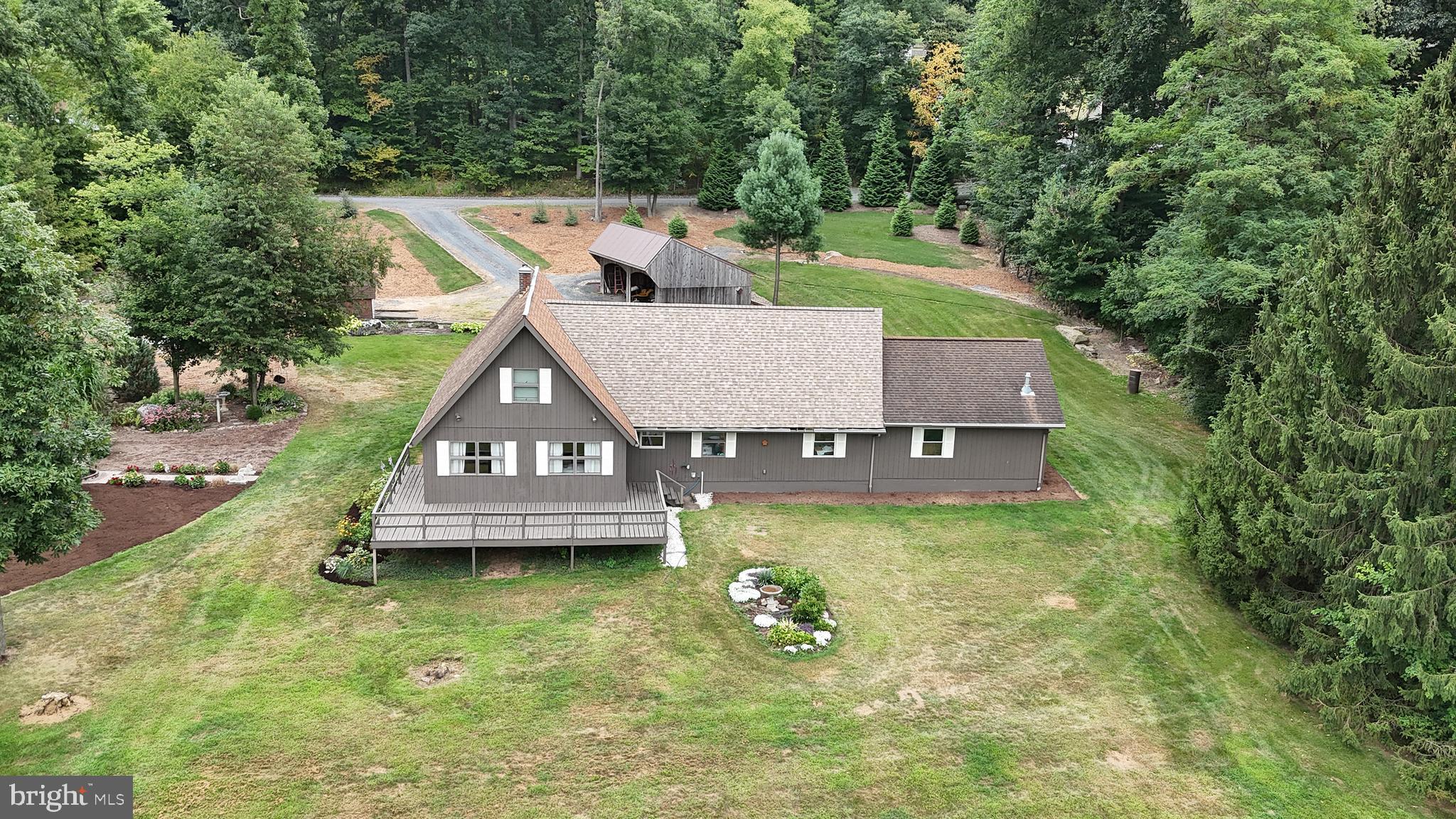 57 Fairview Road Belleville, PA 17004 - Photo 2 of 36 an aerial view of a house with swimming pool next to a big yard