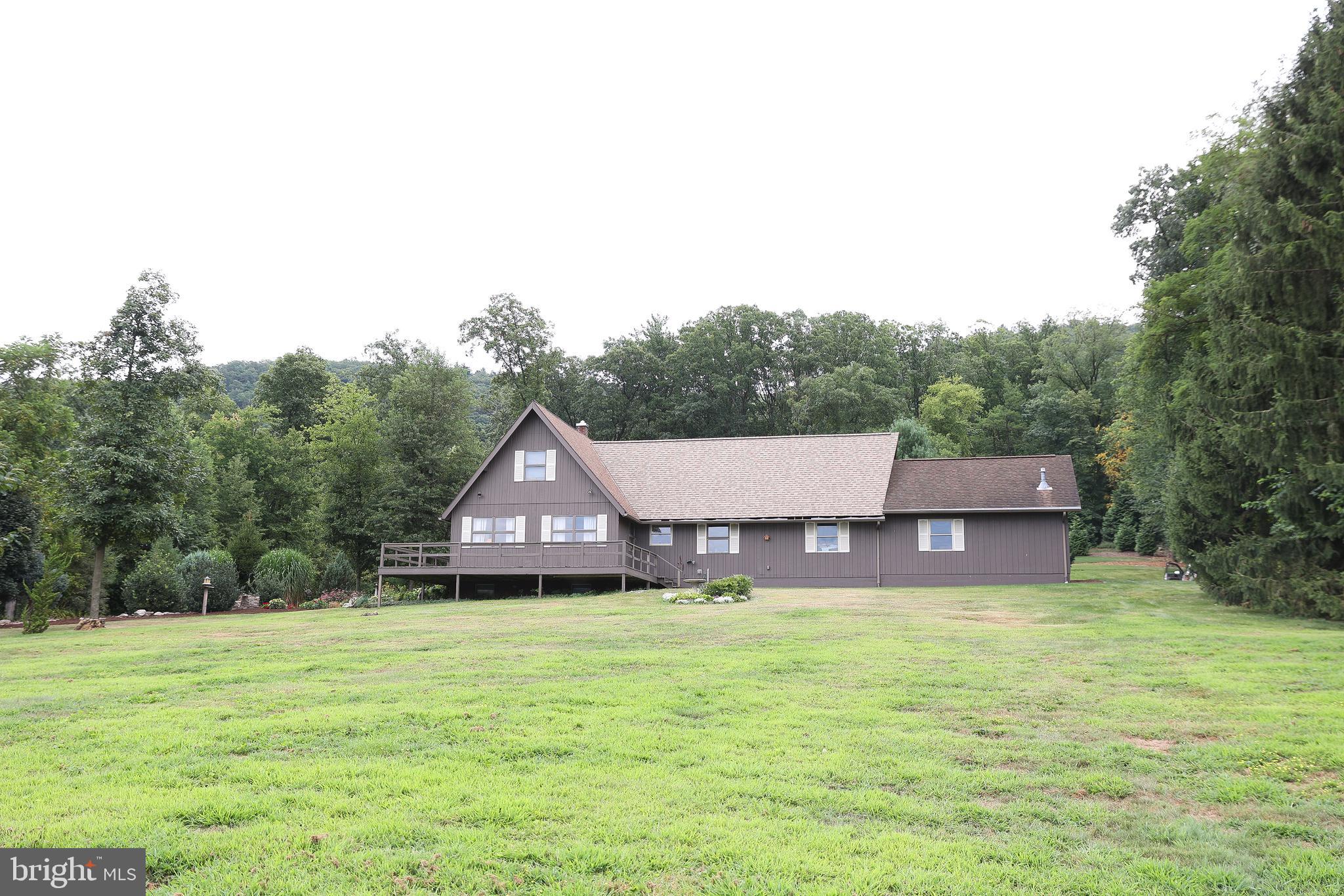 57 Fairview Road Belleville, PA 17004 - Photo 22 of 36 a aerial view of a house with a yard and a large tree