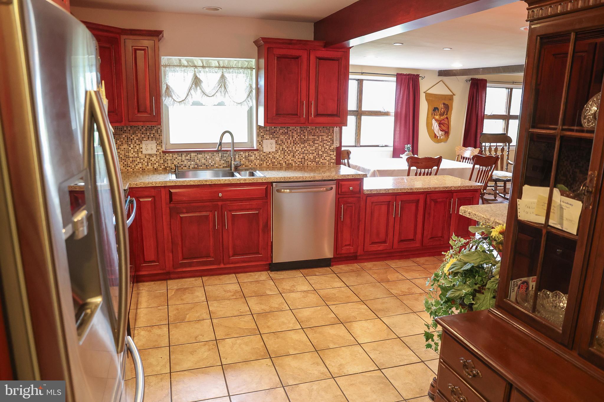 57 Fairview Road Belleville, PA 17004 - Photo 28 of 36 a kitchen with stainless steel appliances granite countertop a refrigerator sink and window