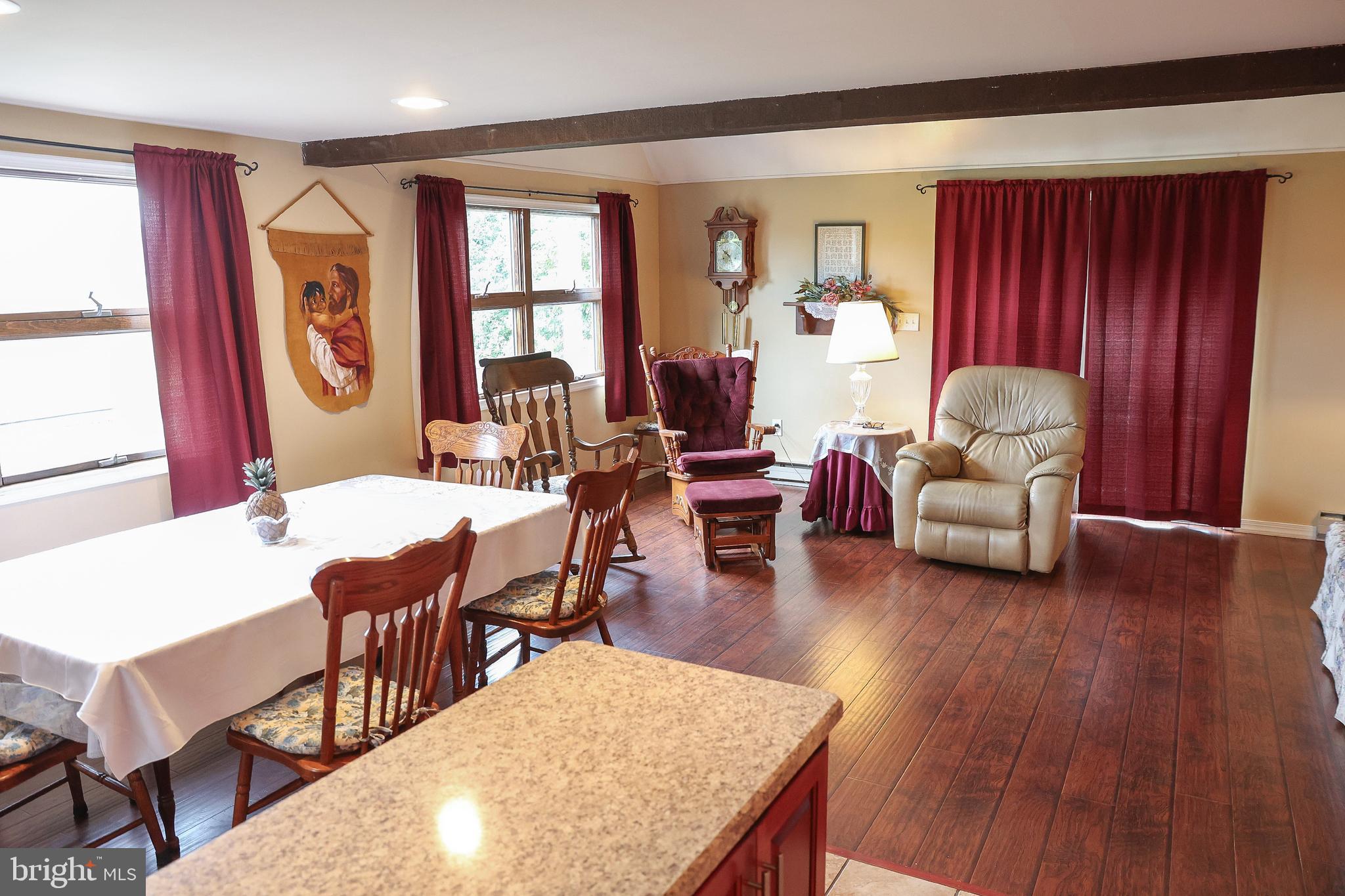 57 Fairview Road Belleville, PA 17004 - Photo 29 of 36 a living room with furniture two window and wooden floor