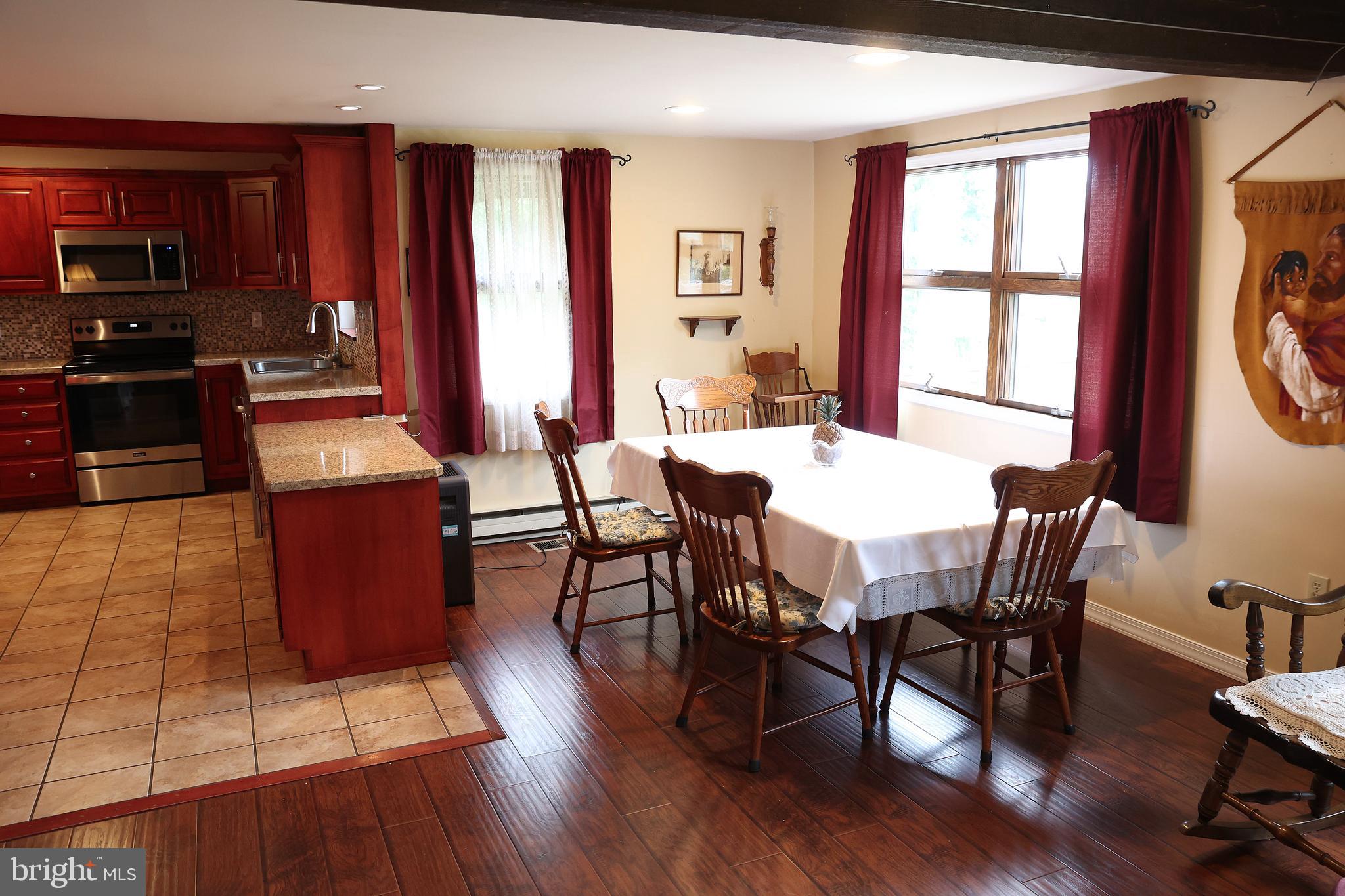 57 Fairview Road Belleville, PA 17004 - Photo 30 of 36 a view of a dining room with furniture window and wooden floor