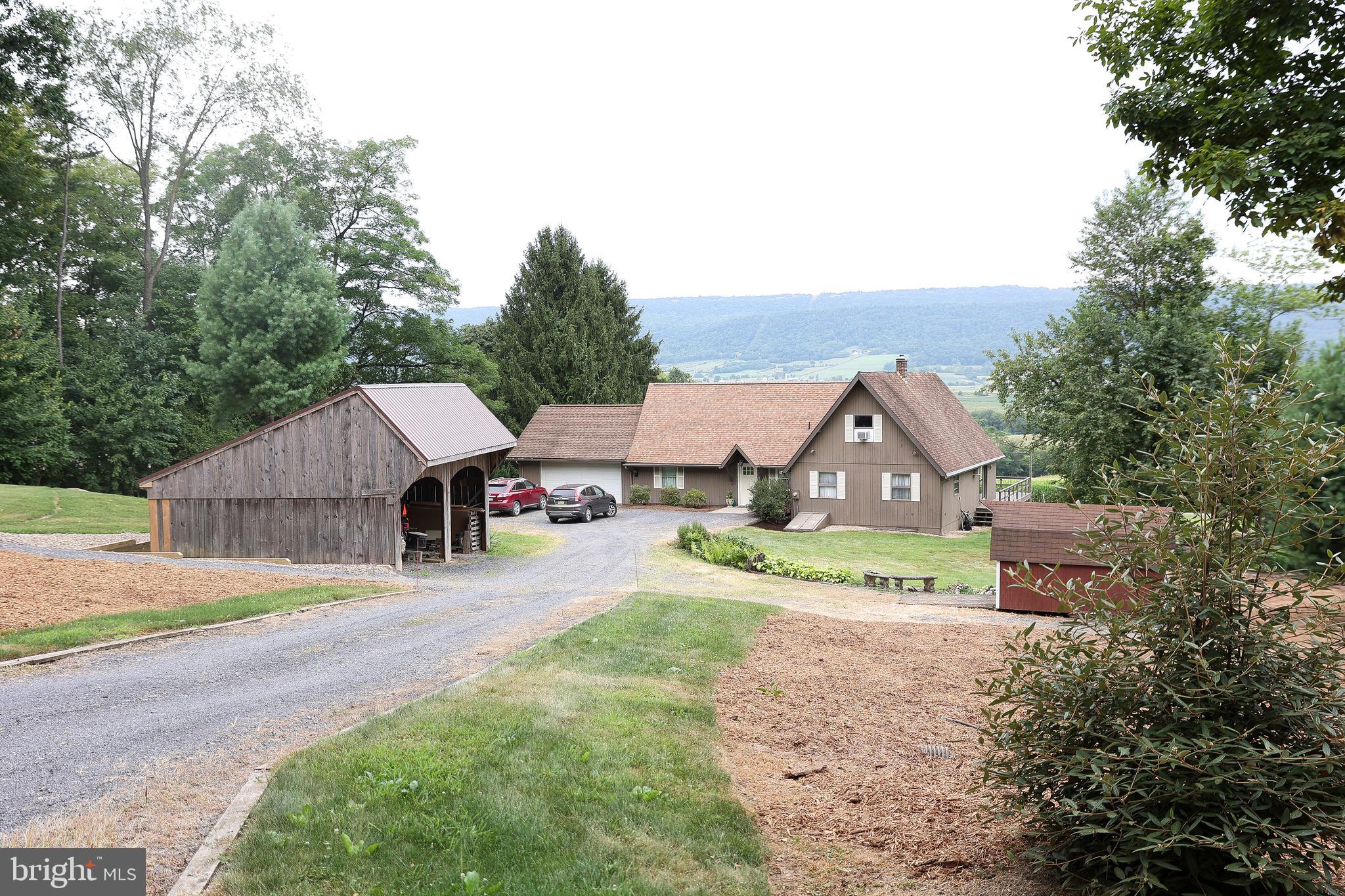 57 Fairview Road Belleville, PA 17004 - Photo 35 of 36 an aerial view of a house with a yard and large trees