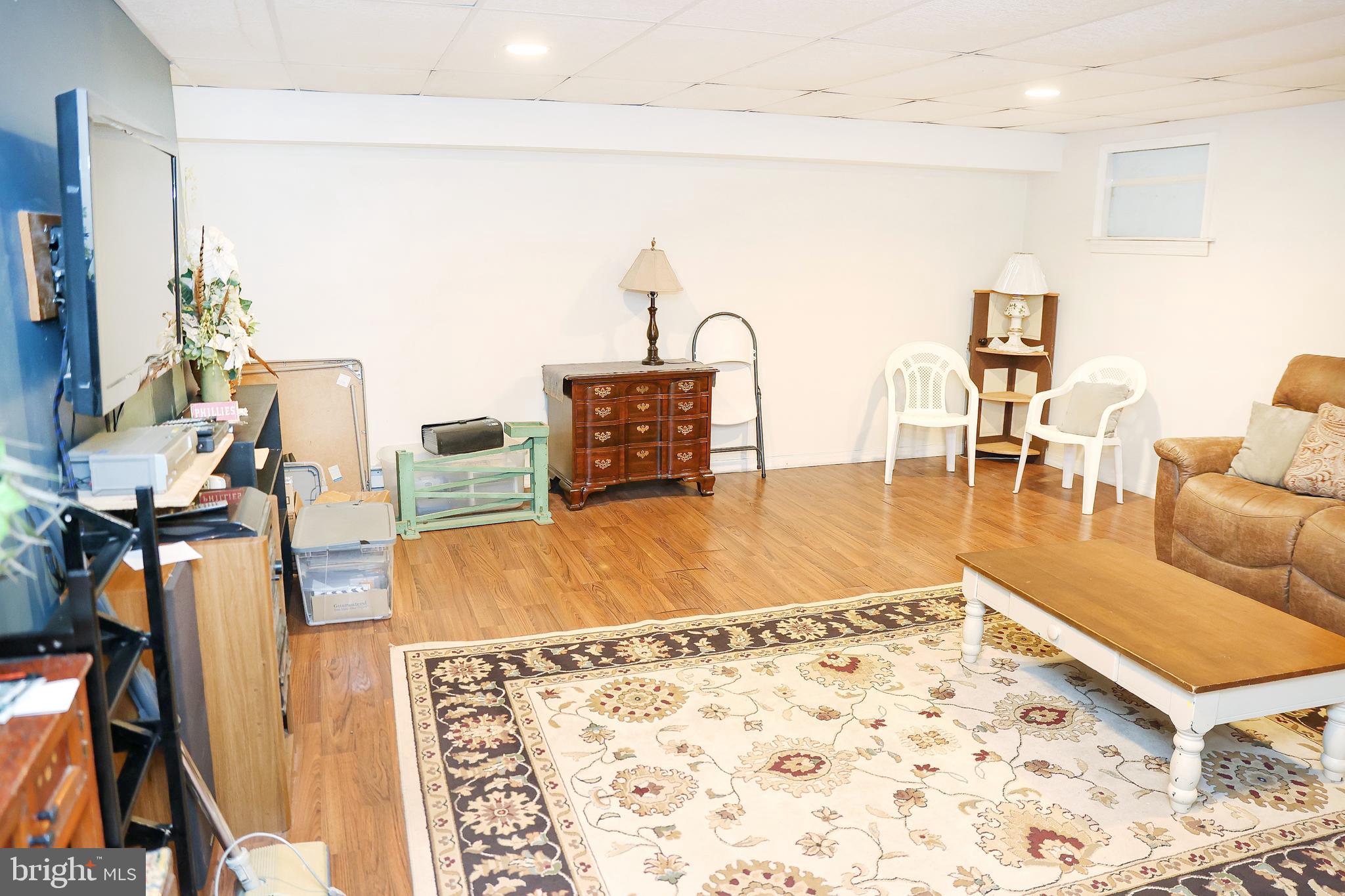 57 Fairview Road Belleville, PA 17004 - Photo 36 of 36 a living room with chairs a rug and kitchen view