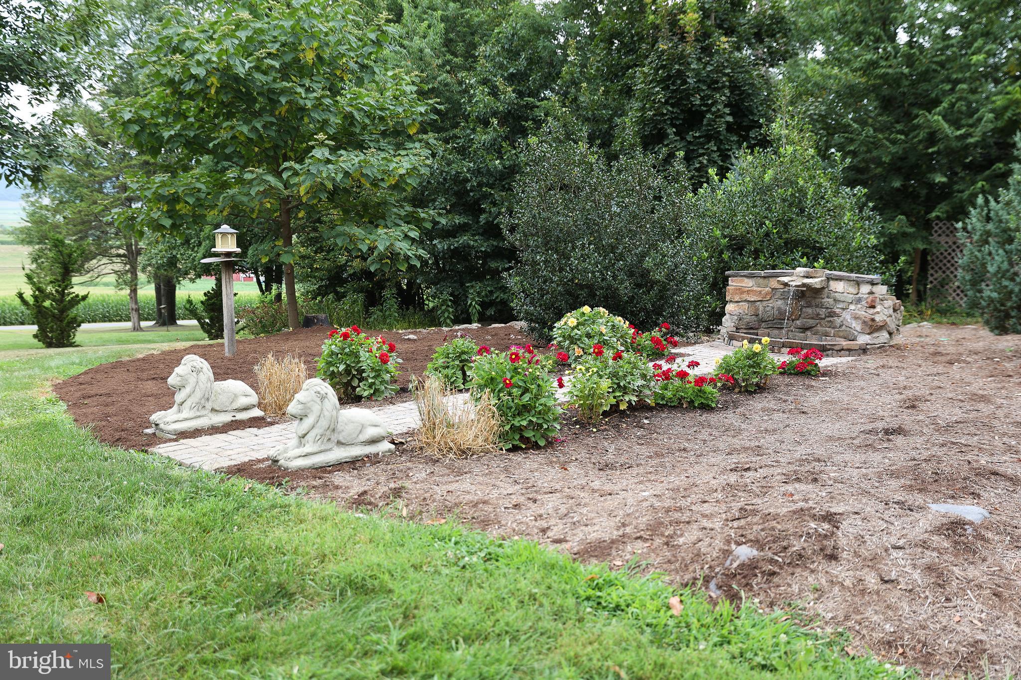 57 Fairview Road Belleville, PA 17004 - Photo 4 of 36 a view of a garden with an outdoor seating
