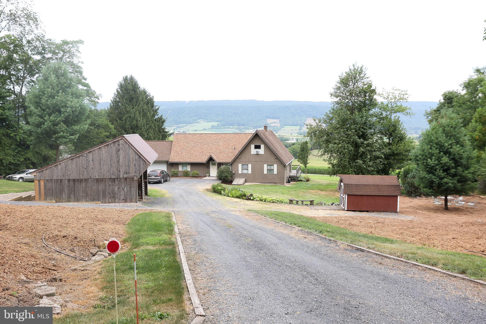 57 Fairview Road Belleville, PA 17004 - Photo 7 of 36 a house view with a garden space