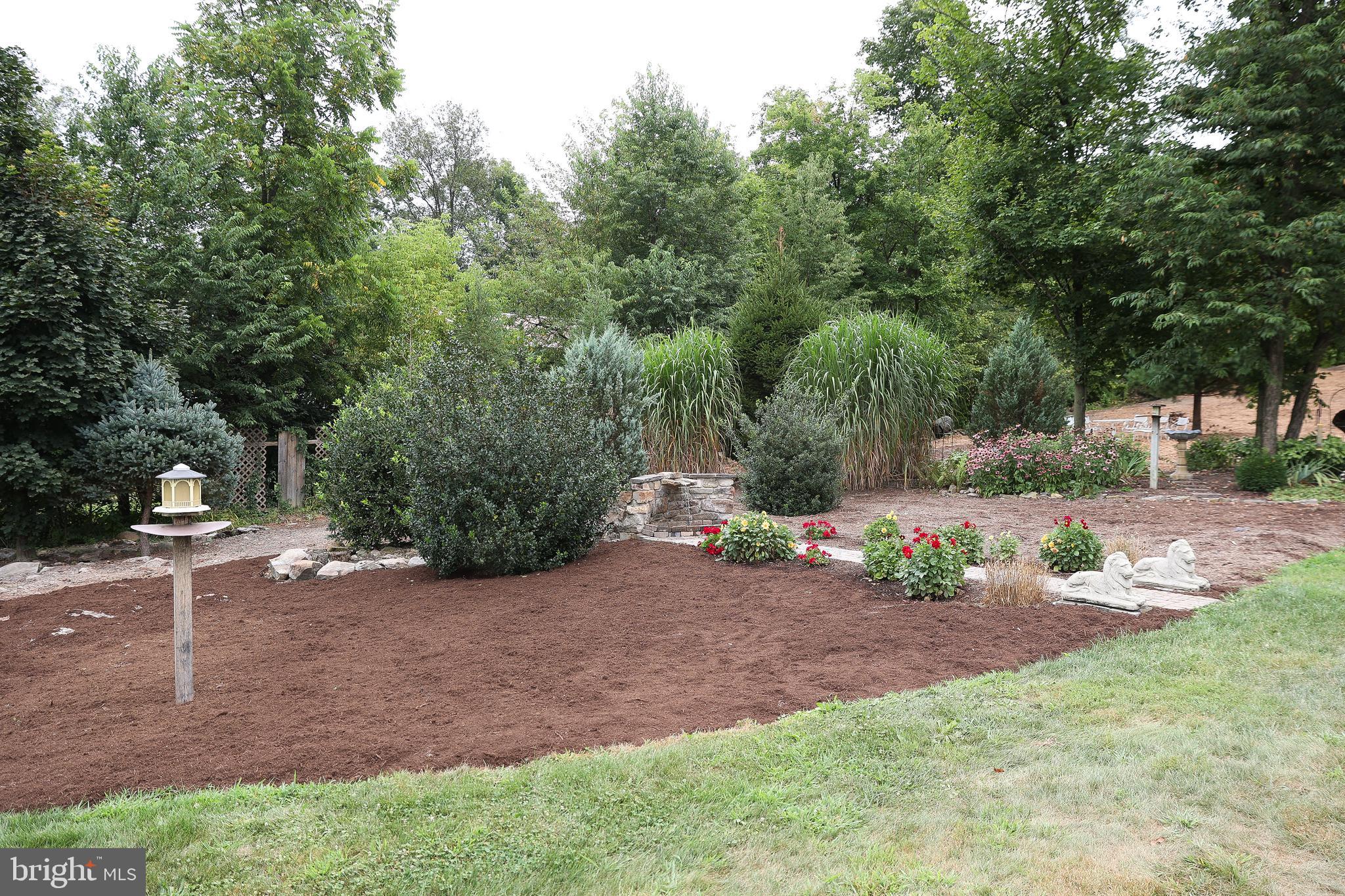 57 Fairview Road Belleville, PA 17004 - Photo 9 of 36 a backyard of a house with table and chairs