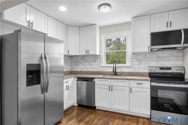 a kitchen with a sink stove and refrigerator