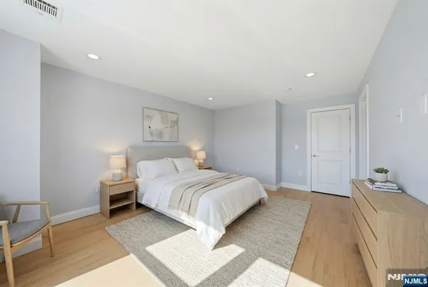 a bed room with a bed and a lamp