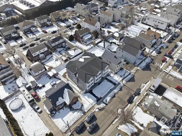 an aerial view of a city with lots of residential buildings