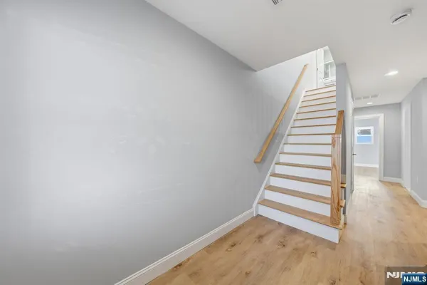 a view of a hallway with stairs
