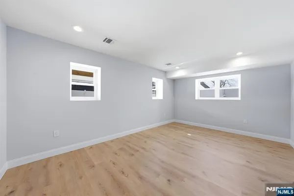 a view of empty room with windows