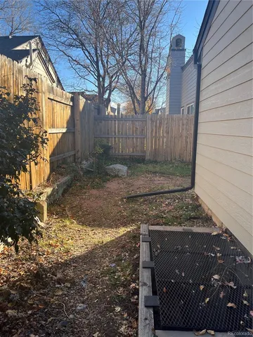 a view of a backyard of the house