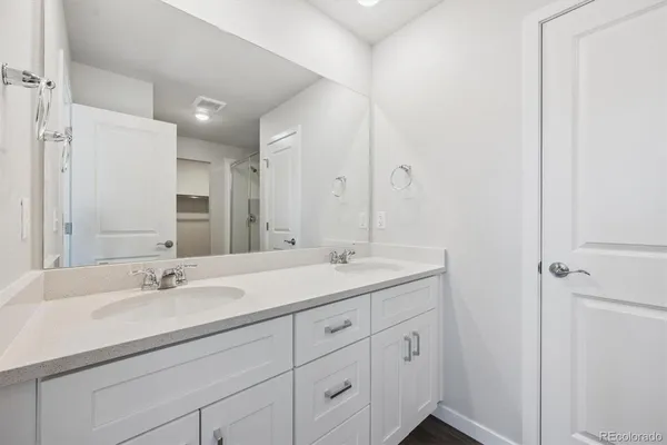a view of a bathroom with wooden floor