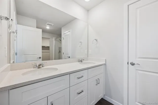 a view of a bathroom with wooden floor