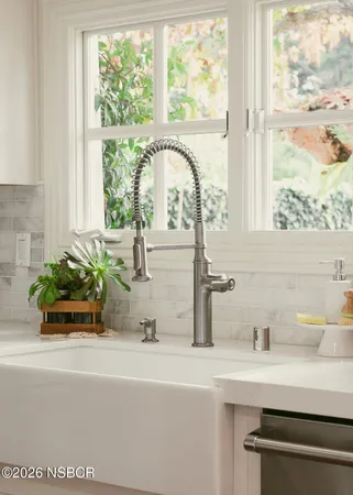 a spacious bedroom with a bed and a couch