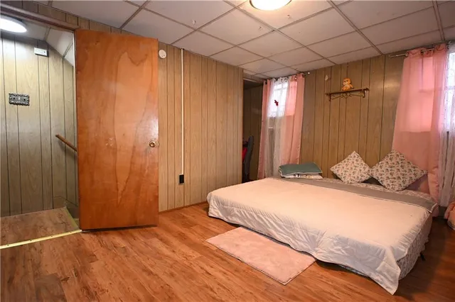 a bed room with a bed and a window