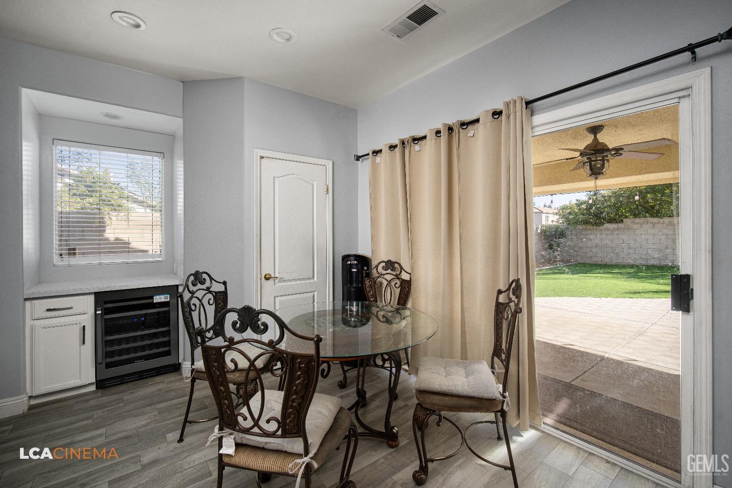 Undisclosed Address Bakersfield, CA 93311 - Photo 13 of 43 a view of a dining room with furniture and a window