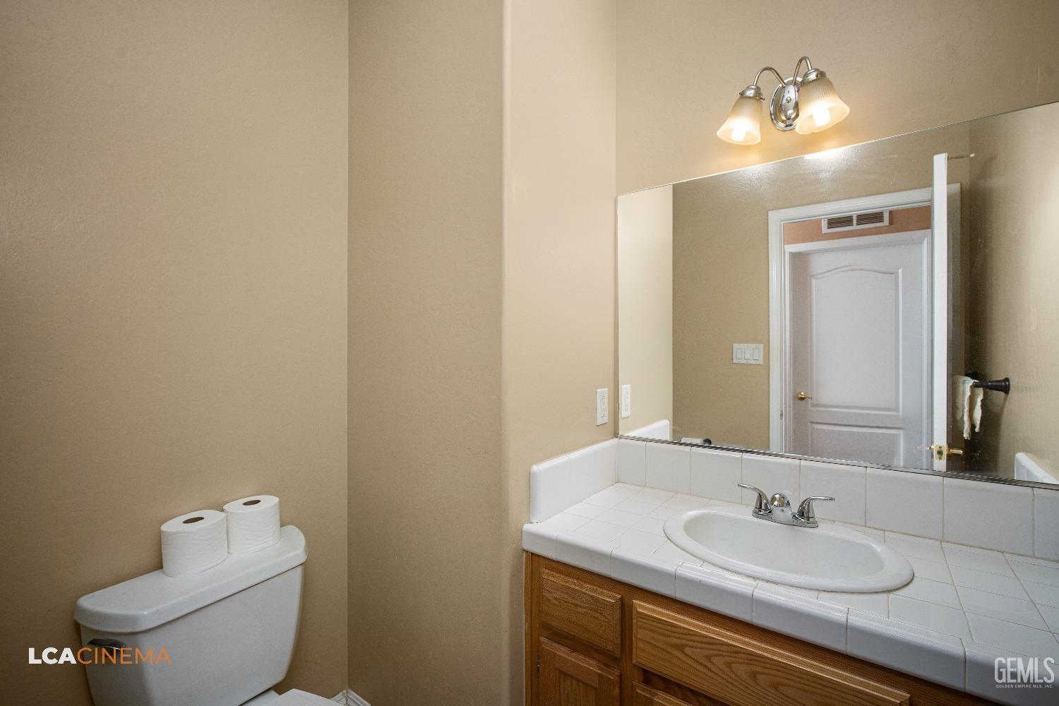 Undisclosed Address Bakersfield, CA 93311 - Photo 15 of 43 a bathroom with a sink and a toilet