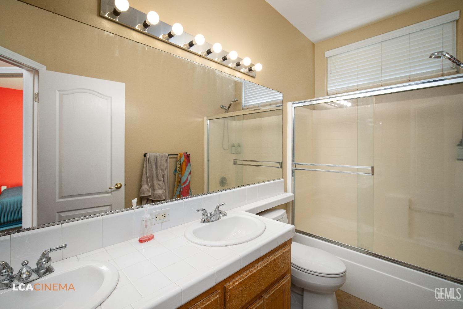 Undisclosed Address Bakersfield, CA 93311 - Photo 18 of 43 a bathroom with a sink toilet and shower