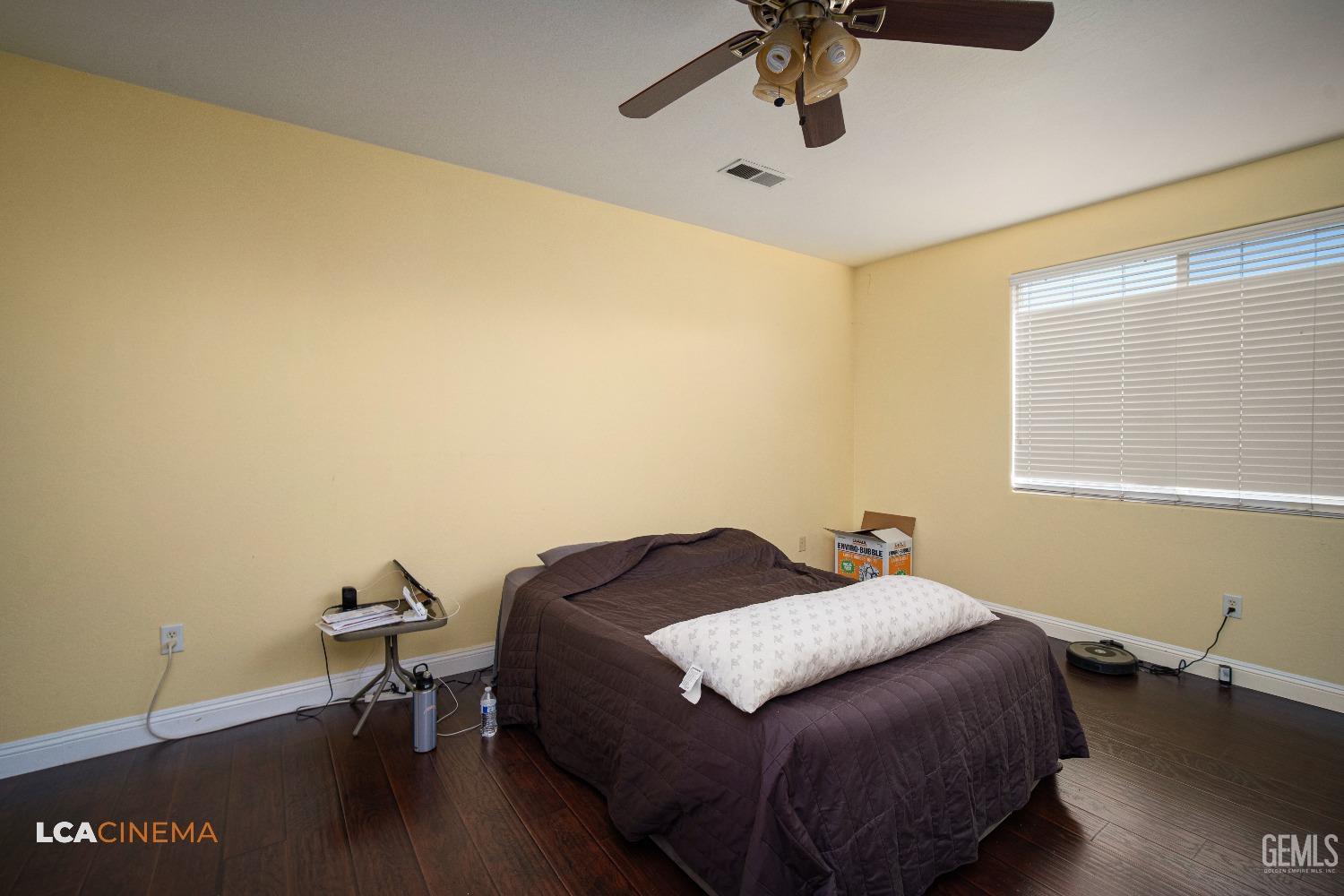 Undisclosed Address Bakersfield, CA 93311 - Photo 19 of 43 a bedroom with a bed and a desk