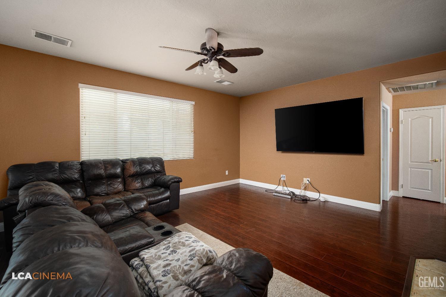 Undisclosed Address Bakersfield, CA 93311 - Photo 21 of 43 a living room with furniture and a flat screen tv