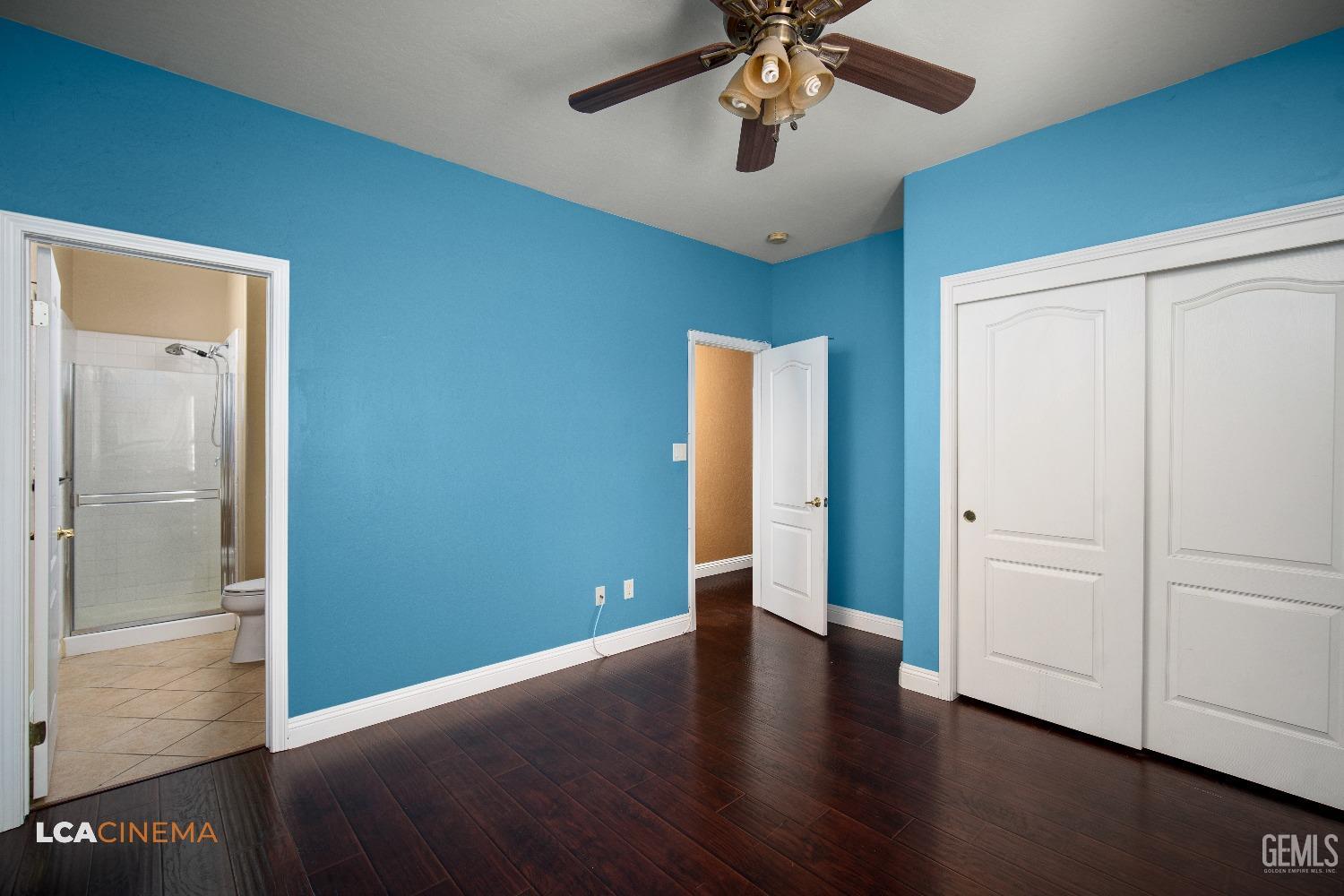 Undisclosed Address Bakersfield, CA 93311 - Photo 23 of 43 an empty room with wooden floor closet and windows