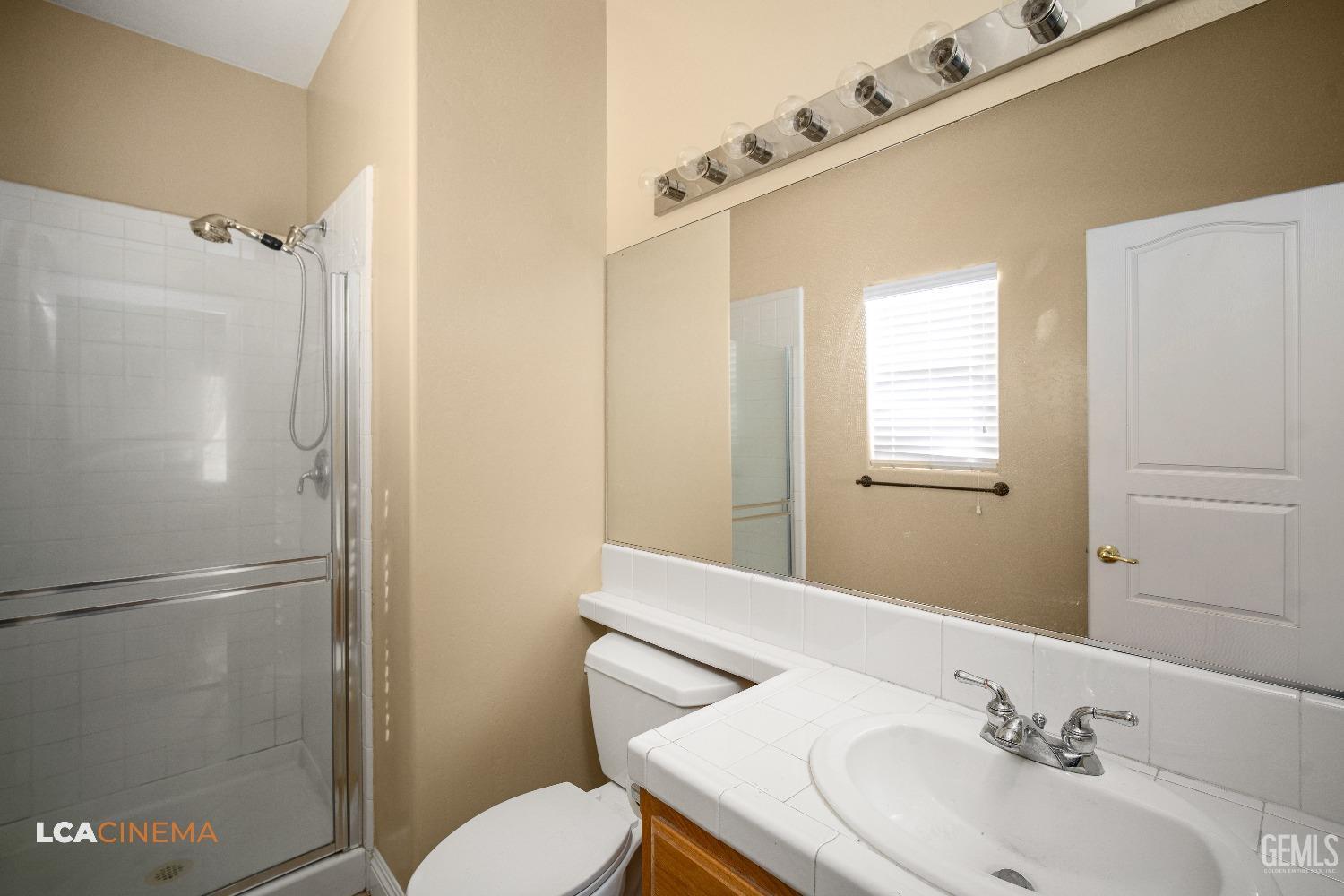 Undisclosed Address Bakersfield, CA 93311 - Photo 24 of 43 a bathroom with a sink toilet and shower