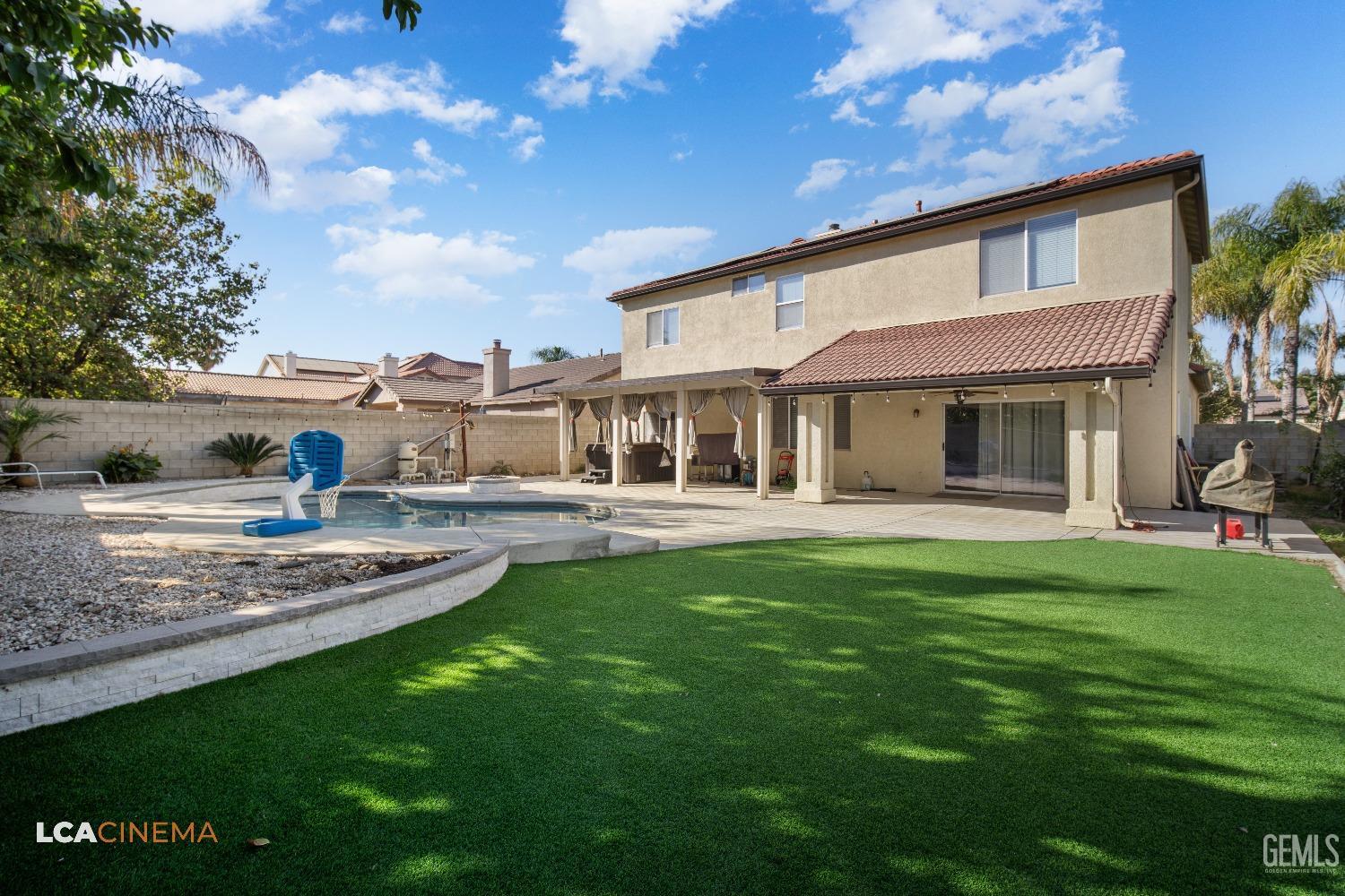 Undisclosed Address Bakersfield, CA 93311 - Photo 27 of 43 a front view of a house with a garden