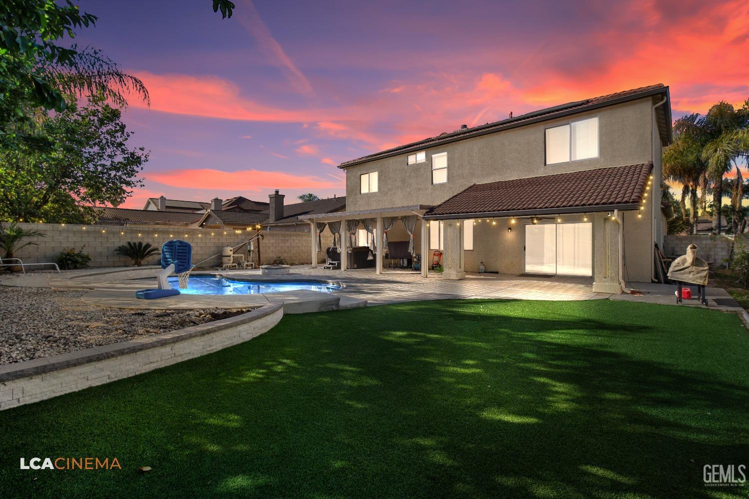 Undisclosed Address Bakersfield, CA 93311 - Photo 29 of 43 a front view of a house with a yard table and chairs