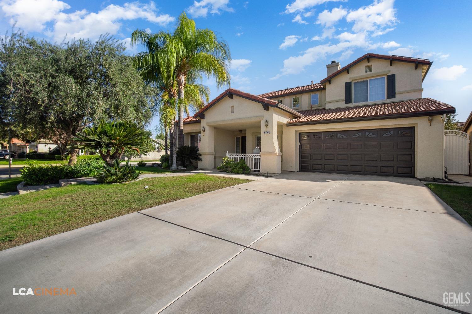 Undisclosed Address Bakersfield, CA 93311 - Photo 3 of 43 a front view of a house with a garden and yard