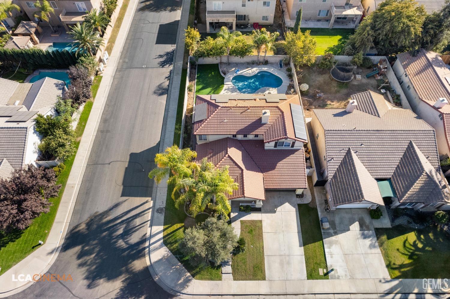 Undisclosed Address Bakersfield, CA 93311 - Photo 42 of 43 an aerial view of a house with a swimming pool