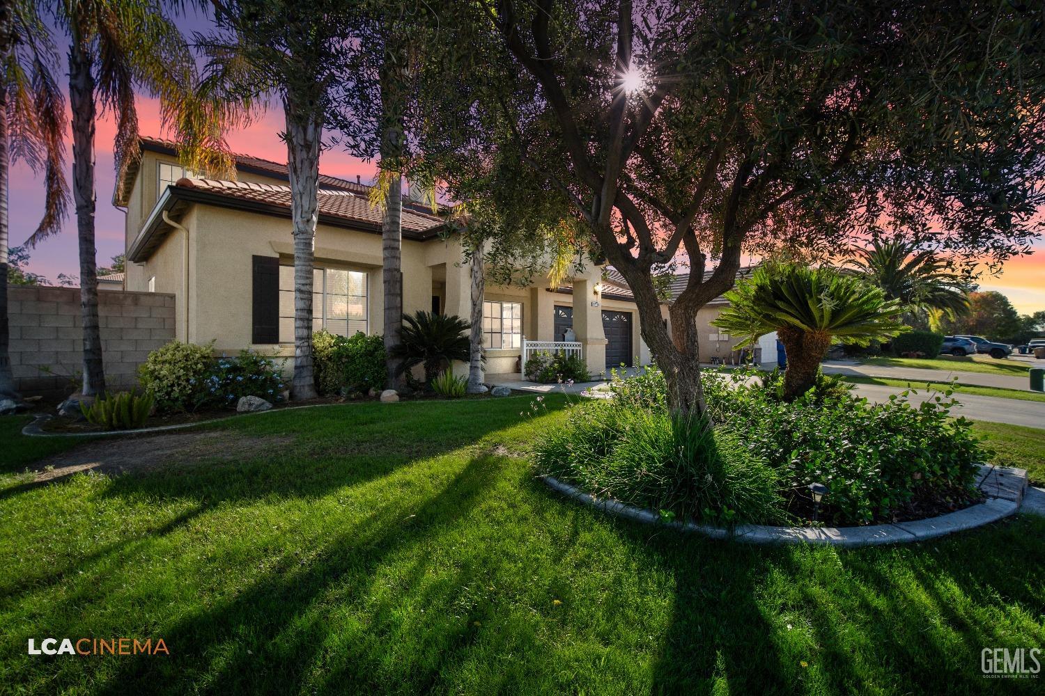 Undisclosed Address Bakersfield, CA 93311 - Photo 5 of 43 a front view of a house with a yard