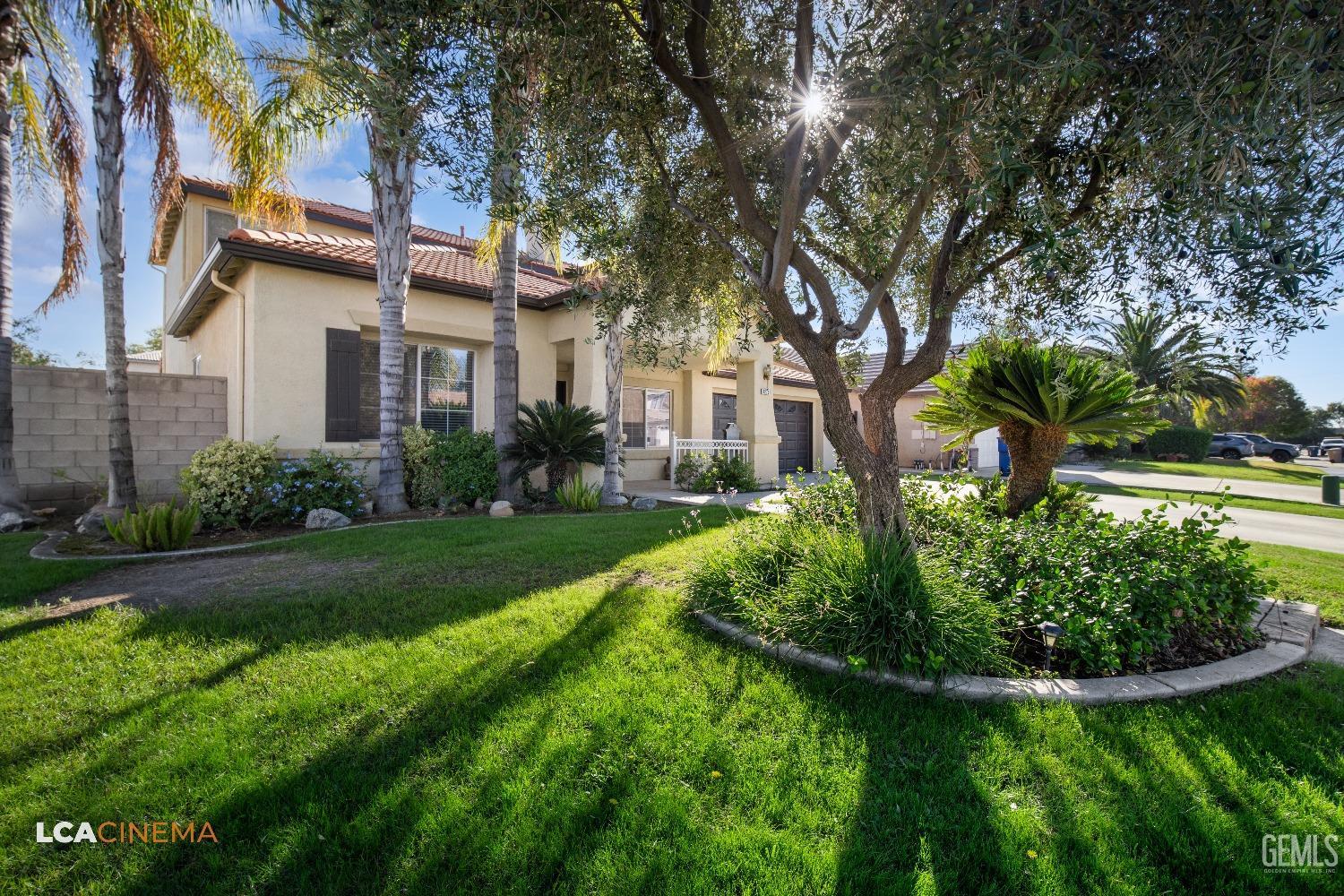 Undisclosed Address Bakersfield, CA 93311 - Photo 6 of 43 a front view of a house with garden