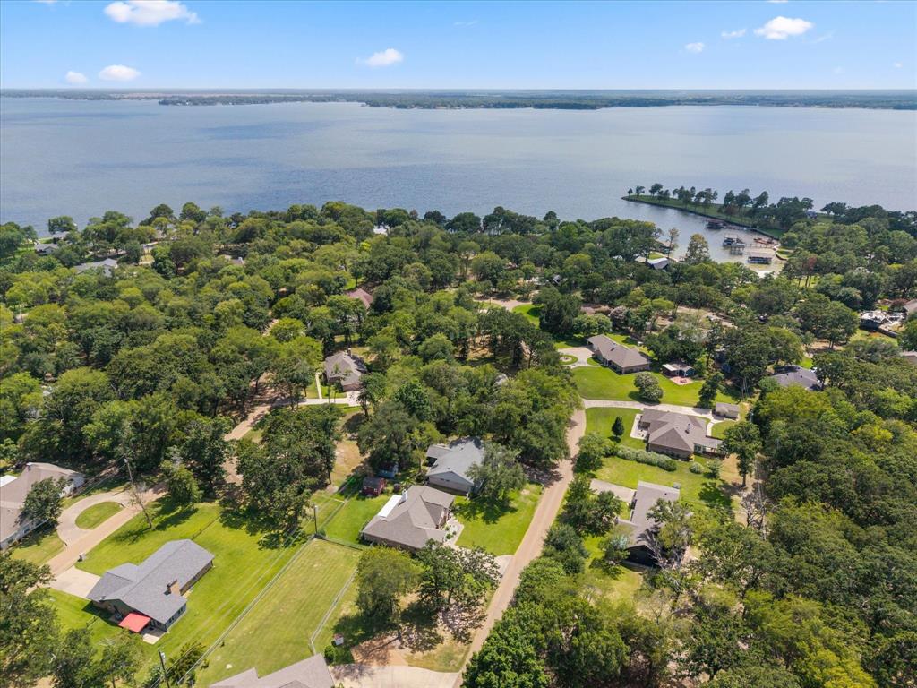 116 Meadowood Road Enchanted Oaks, TX 75156 - Photo 33 of 37 Expansive aerial perspective showcasing a residential area with significant tree coverage