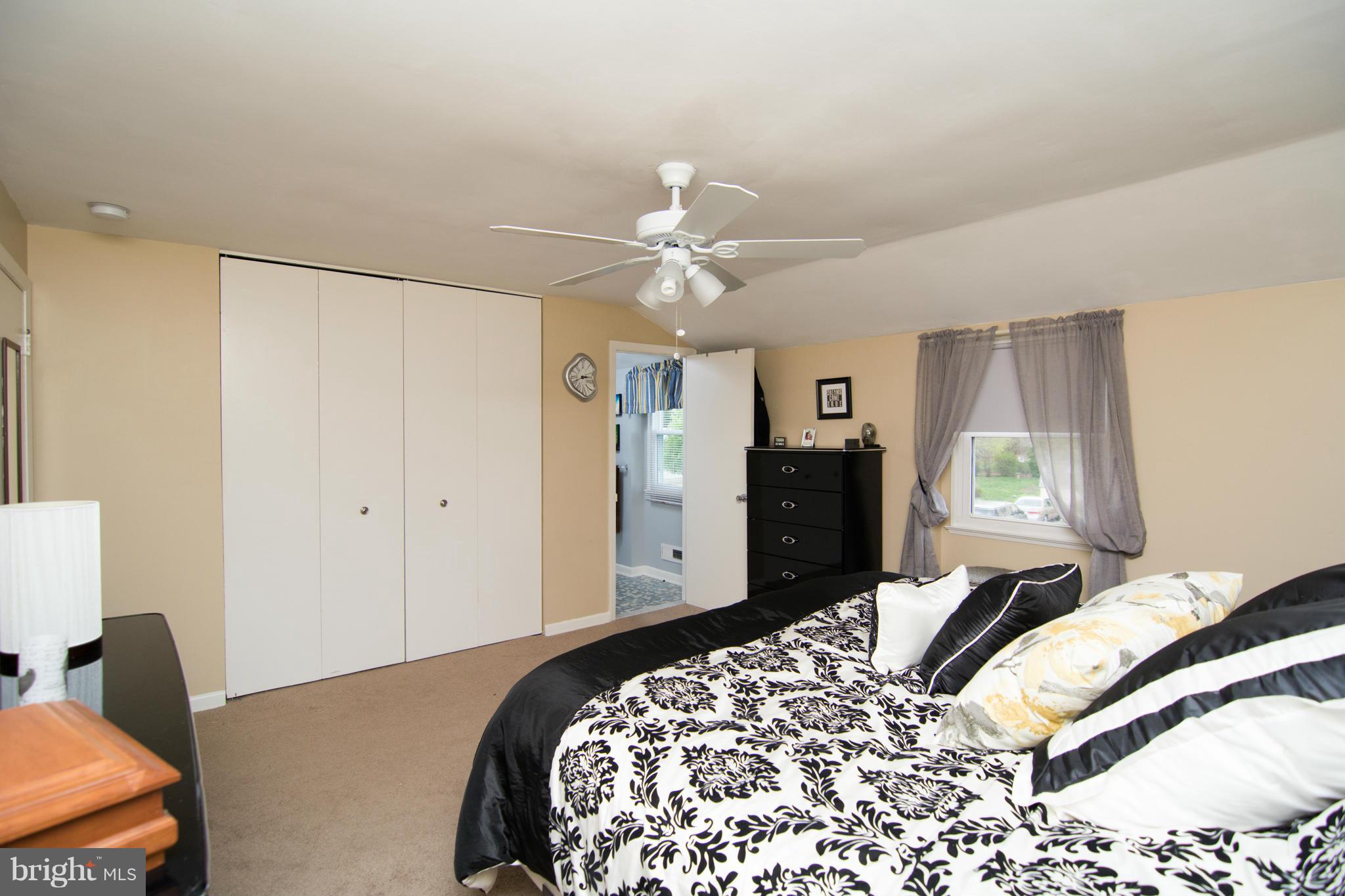 1400 Woodbridge Road Baltimore, MD 21228 - Photo 22 of 29 a bedroom with a bed and a chandelier