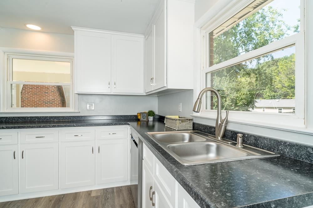 120 Robinhood Road Staunton, VA 24401 - Photo 5 of 38 a kitchen with granite countertop a sink a counter top space and cabinets