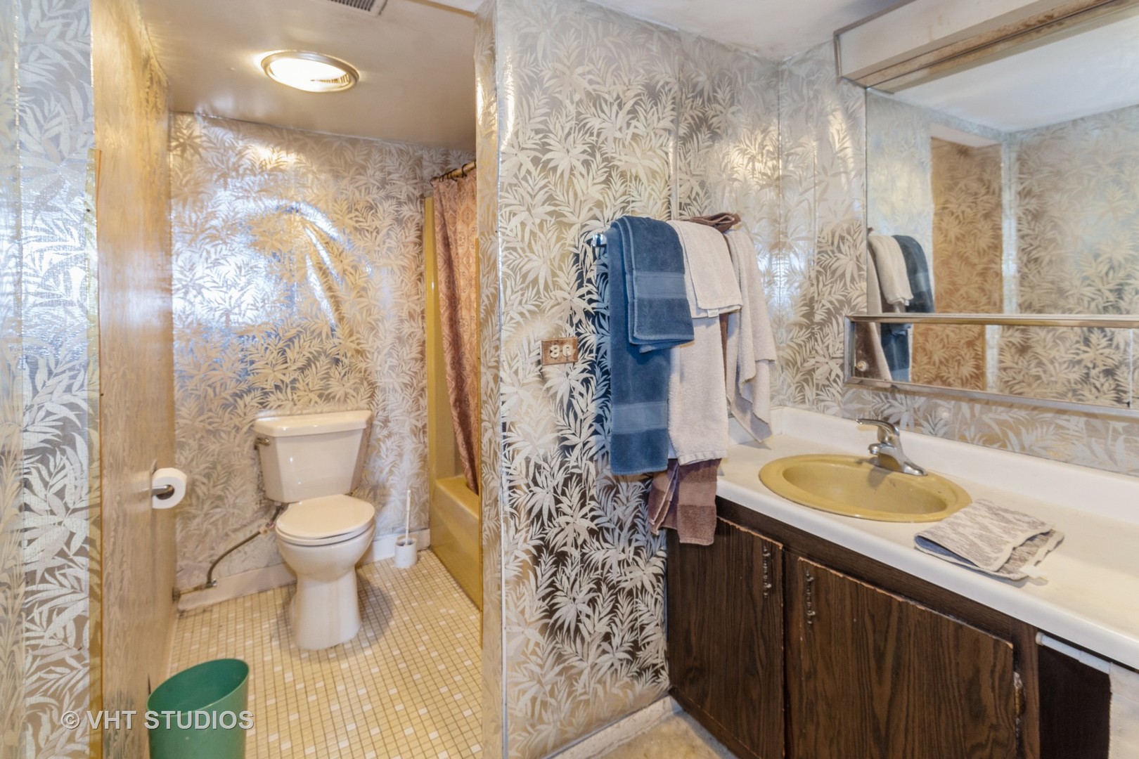 511 Timber Ridge Drive, Unit 304C Carol Stream, IL 60188 - Photo 6 of 12 a bathroom with a sink toilet and shower