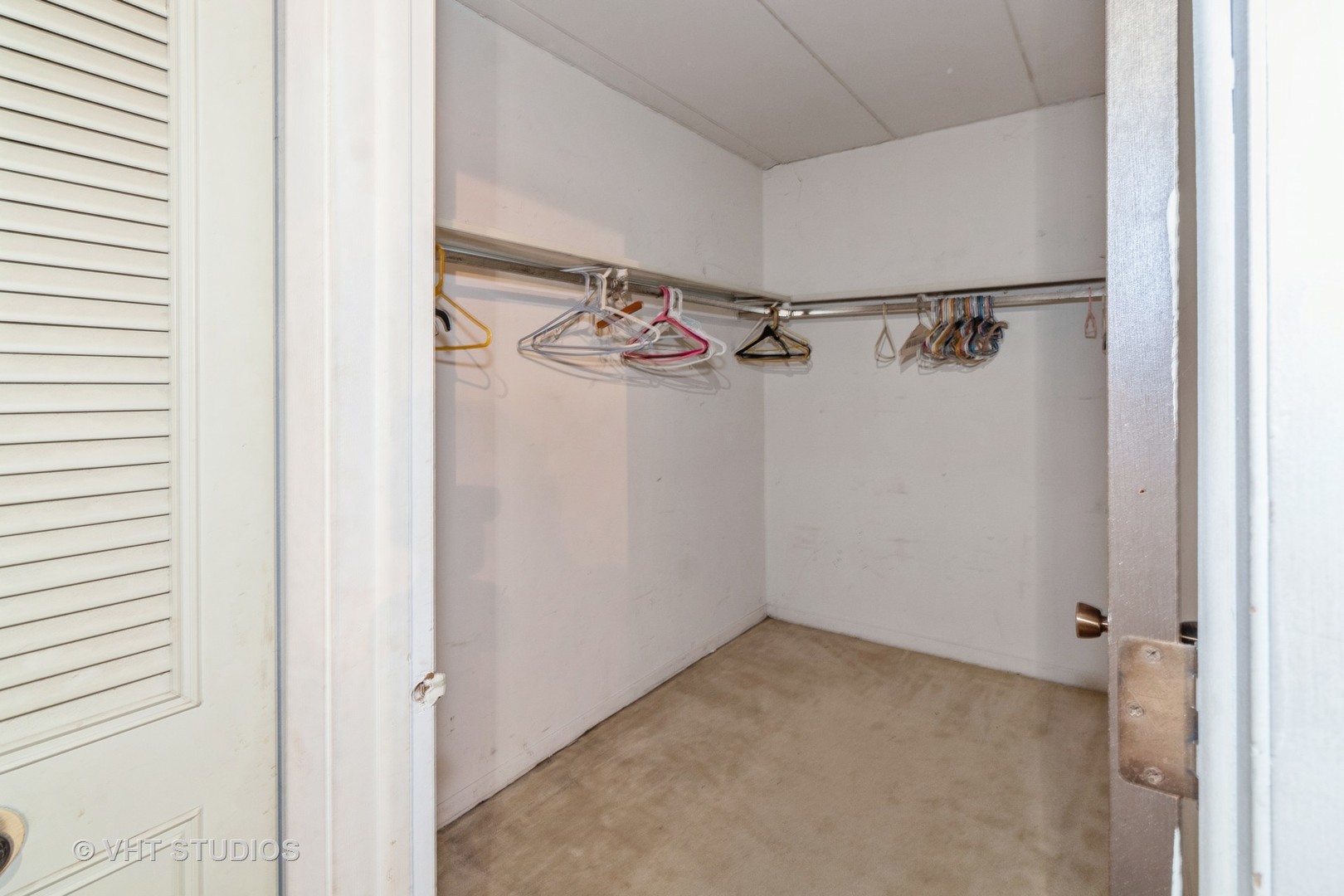 511 Timber Ridge Drive, Unit 304C Carol Stream, IL 60188 - Photo 10 of 12 a view of a room with racks on the wall