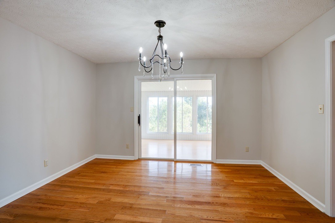 418 Spout Spring Road Dover, TN 37058 - Photo 11 of 36 a view of empty room with wooden floor and fan