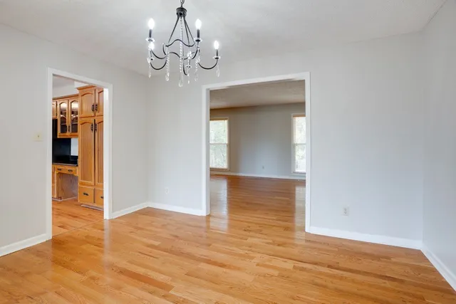 a kitchen with stainless steel appliances granite countertop a refrigerator a stove and a sink