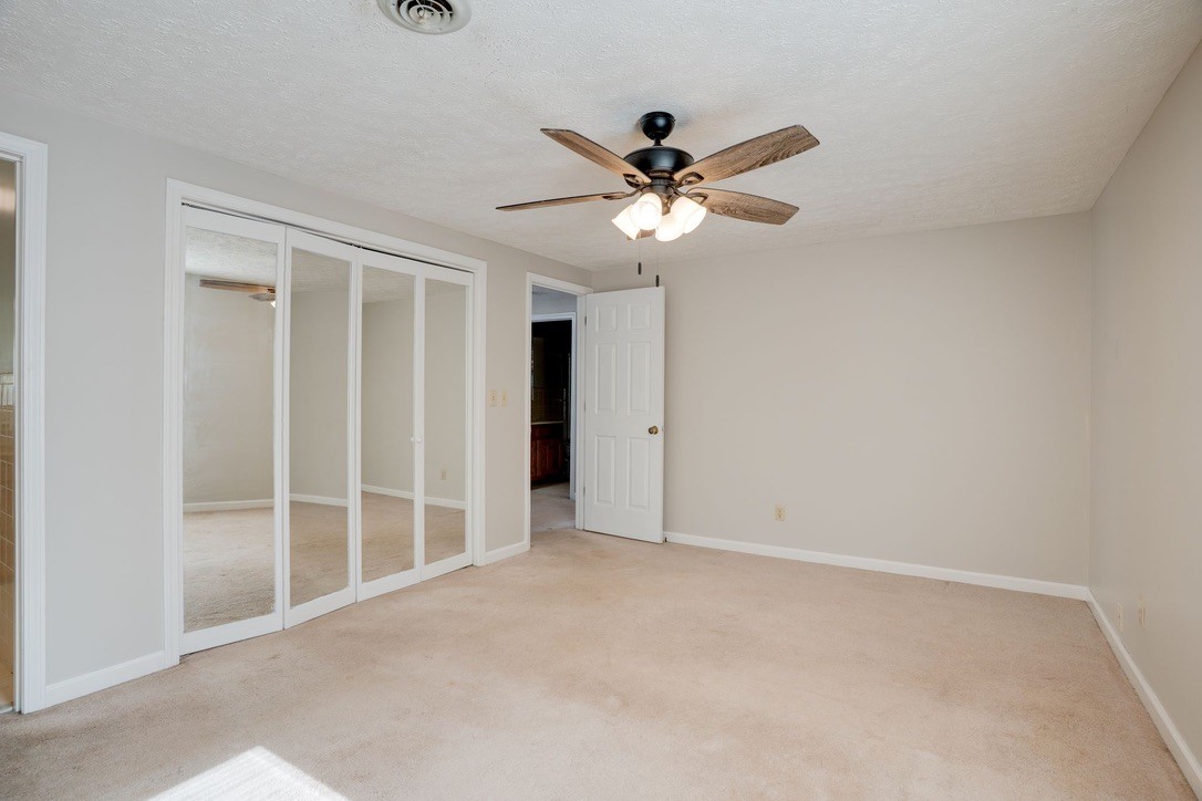 418 Spout Spring Road Dover, TN 37058 - Photo 17 of 36 an empty room with windows and fan